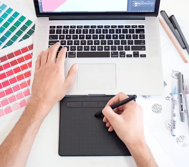 Graphic designer doing a digital drawing on his drawing pad